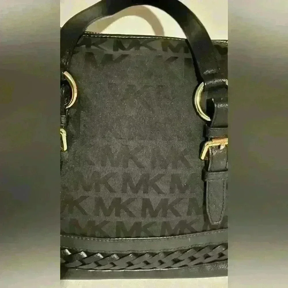 A Mickael Kors black Gladstone satchel with gold tone hardware.